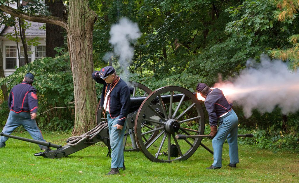 MEMBERS of the Fifth Massachusetts Battery (E), Light Artillery, Army of the Potomac, set off a cannon on the South Common last weekend as part of their Civil War encampment demonstration of the training that took place at Camp Stanton in Lynnfield. According to historical accounts, "the roar of artillery and the deafening cannon" could be heard from the campground in the morning and at sunset. Located on both sides of the Newburyport Turnpike near Suntaug Lake, it opened as Camp Schuyler in 1861 and continued as Camp Houston through 1917 as a state National Guard mobilization camp, serving as the general rendezvous of recruits from nine counties. The encampment was part of the Historical Commission's Lynnfield 2014 bicentennial/tricentennial celebration.                            (Greg Pronevitz Photo)