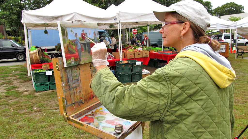 WEST SIDE resident and artist Pam Perras was spotted at Farmers Market painting outdoors. The scene she is working on is what she observed Saturday morning, Oct. 4.(Gail Lowe Photo)