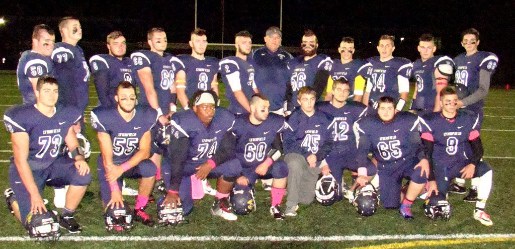 SENIOR NIGHT. The seniors enjoyed celebrating with their friends and parents before the game with Ipswich. Now it's on to the playoffs for the 7-0 Pioneers. Front row (from left) Brandon Troisi (73), Steve Kinnon (55), Edison McIntosh (74), Matt Albano (60), Lucas Pascucci (45), Kevin Lee (42), Dylan Shaffer (65) and Marc Budd (9). Back row (from left) Nick Wilkinson (50), Steven White (77), Jake Rourke (6), Al MacLachlan (66), Captain Cam Rondeau (8), Captain Danny Sullivan (2), Head Coach Neal Weidman, Captain David Adams (56), Captain Jon Knee (10), Chad Martin (14), Rob Debonis (3) and Chris O’Neill (89).     (Tom Condardo Photo)