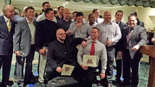 THE 1999 Super Bowl champion football team was inducted into the WMHS Athletic Hall of Fame during the 13th induction ceremonies last Saturday night at the Crystal Community Club. In the front row are Andy Brown (left) and Bill Morrison. In the second row (from left to right) are Assistant Coach Perry Verge, Head Coach Mike Boyages, Assistant Coach Tom Crusco, Justin Chapman, Mark Sullivan, Dylan Conn and Assistant Coach Al Lisitano. In the back row (from left to right) are Paul Uva (hidden), Kirk Irons, Steve Boccelli, Justin Costello (slightly hidden), Mike Spivey, Steve Sorrentino, Wayne Ulwick and Bob Caira (hidden). (Dan Byrne Photo)