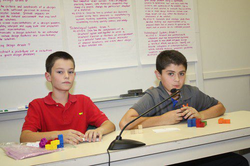 SIXTH GRADERS Domenico Simonetti (left) and Thomas Pascuccio discussed the puzzle cubes STEM project at the School Committee’s Nov. 4 meeting.                                    (Dan Tomasello Photo)