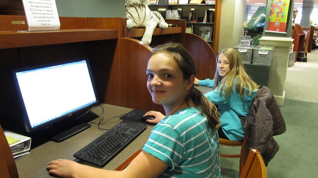 GRADE 7 students at the Galvin Middle School Marisa Ogier, left, and Alandra Ponze were at the Beebe Library Thursday working on a Social Studies project. (Gail Lowe Photo)