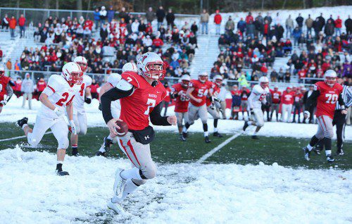 SENIOR QB Anthony Cecere runs down the right sideline as Melrose’s Zack Mercer (#24) is the closest player in pursuit. Cecere was Wakefield’s leading rusher with 54 yards on 10 carries with a touchdown. (Donna Larsson Photo)