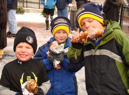 MY THREE SONS. Head Coach Neal Weidman’s three boys, from left: Tripp, Cal and Hudson Weidman, enjoy post-game turkey legs to celebrate their dad’s Thanksgiving Day victory over North Reading.   (Tom Condardo Photo)