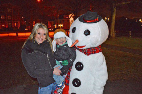 DURING FRIDAY NIGHT’S tree lighting ceremony at the Veterans Memorial Common, Mark O’Brien III got a chance to meet Frosty the Snowman and loved every minute of it. (Mark O’Brien Photo) 