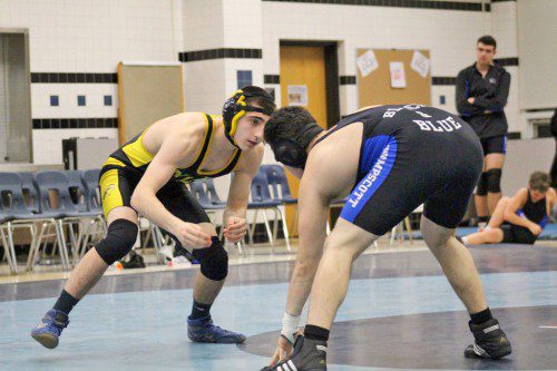 SENIOR Garrett Anderson (at left) pinned his Marblehead-Swampscott opponent in 30 seconds during the 145 lbs. weight class on Dec. 23. The Black and Gold defeated Marblehead-Swampscott 66-6. (Courtesy Photo)