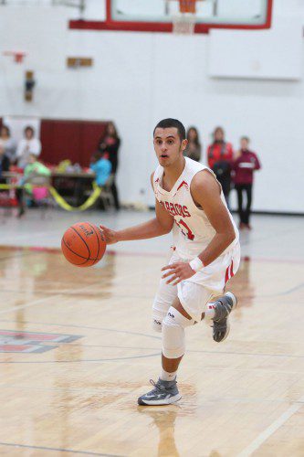 CHRIS CALNAN, a senior point guard, played tremendous defense on Burlington’s Chris DiMartinez which helped Wakefield prevail by a 59-53 score. Calnan scored three points, had six rebounds and four assists. (Donna Larsson File Photo)
