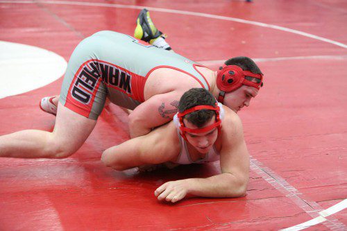 ALEX KANE, a senior (left), captured the title at the 220 weight class in the Belmont Tournament on Saturday. Kane won two matches by pin and pulled out a three overtime decision in the title bout. (Donna Larsson File Photo)