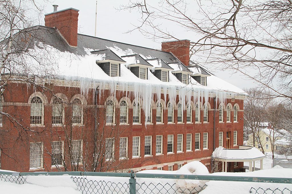 THE McCARTHY SENIOR CENTER, at one time known as the Warren School, withstands yet another (albeit historic) winter. (Donna Larsson Photo)