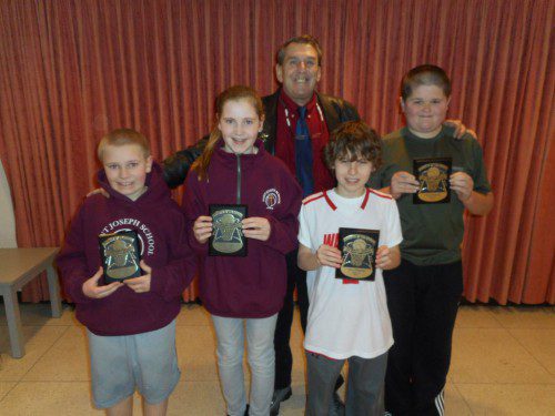 WINNERS OF the Wakefield Knights of Columbus “Free Throw Championship” are pictured with their championship plaques. In the front row (l to r) are Matthew Gaffney, Maeve Gaffney, Max Dimella and Paul Holman. Standing in the back is Grand Knight Jack Roche. Lucas Smith was absent for the photo.