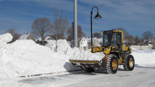 PRIVATE Contractor John DiTonno was busy at work on Wednesday clearing the Galvin Middle School driveway and parking lot. DPW workers and private contractors will probably continue their snow removal efforts throughout the weekend and into Monday. Some weather forecasters are calling for another foot of snow.  (Gail Lowe Photo)