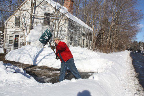 SHOVEL FULL by shovel full, Roy Sorli manages to dig out a path from his doorway to Main Street on Wednesday, a day after the Blizzard of 2015 left behind over two feet of snow and shut down the state. (Maureen Doherty Photo)