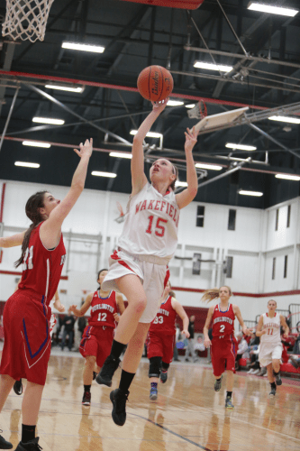 GRACE HURLEY, a junior guard (#15), scored nine points including two clutch free throws which wound up being the difference as the Warrior girls’ hoop team edged Hamilton-Wenham, 44-43, in the consolation game of the Patton Tournament.  (Donna Larsson File Photo)