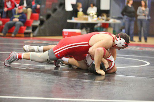 THE MHS wrestling team earned a league title next week after defeating Wakefield. One key match was by Melrose’s Mike Doucette. (Donna Larsson photo)