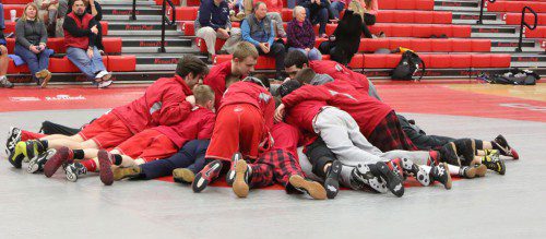 THE MEMBERS of the WMHS wrestling team get into a prematch scrum during a recent dual meet. The Warriors compete in the Div. 3 North in the state duals over the weekend and posted a 1-1 record to advance to the quarterfinals. (Donna Larsson File Photo)