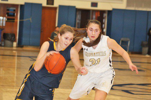 SENIOR CAPTAIN Emma Mancini drives to the hoop during the Pioneers' 47-34 loss to Bishop Fenwick in the Division 3 North quarterfinals on Feb. 26 at St. John's Prep. Mancini led the Pioneers with 19 points, 11 rebounds and a block. (Dan Tomasello Photo)