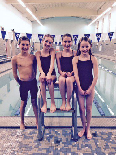 SEAN KAY, ELLIE WALSH, Emma Wright & Catherine Curry (left to right) competed in the 2015 USA New England 12 & Under Championships in White River Junction, Vermont. They represented the YMCA of Metro North Sharks in this elite meet. (courtesy photo)