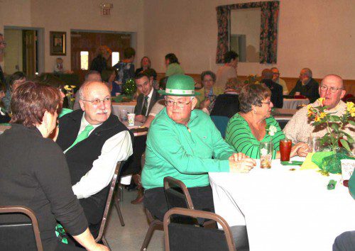 THE EVENT PLANNING COMMITTEE held another successful Shamrock Festival yesterday at the West Side Social Club, complete with plenty of laughs, a lot of great food and the smooth jazz sounds of the Judith Murray Quartet. Here, Jim Phipps (left) shares some thoughts with Kevin Majeski. (Donna Larsson Photo)