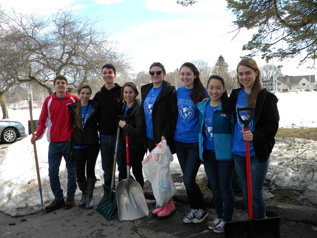 WEDNESDAY was Warrior Give Back Day and these helpful high school students devoted their half day off from school shoveling the sidewalk around the Lake and picking up litter. From left: sophomore Jackson Kehoe, seniors Waverly Stanfield, Michael Mouradian and Lauren Sallade, juniors Olivia Spiers and Kristen Scheeler, senior Vanessa Chin and junior Averi Parece. (Maureen Doherty Photo)