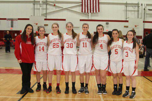 THE WMHS girls’ basketball team recently held Senior Night at the Charbonneau Field House and honored the Warrior seniors. From left to right are team manager Kristina Redmond, Alyssa Rossino, Mackenzie Collins, Julia Filippone, Jillian Raso, Daniella Iannuzzi, Nicole Galli and Amanda Boulter. (Donna Larsson Photo)