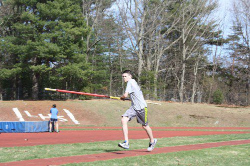 FRESHMAN Jack Madden sprints down the runway on the approach to the pole vault at Thursday's practice. It was his first day trying the event as a member of the Pioneers' track team. (Maureen Doherty Photo)