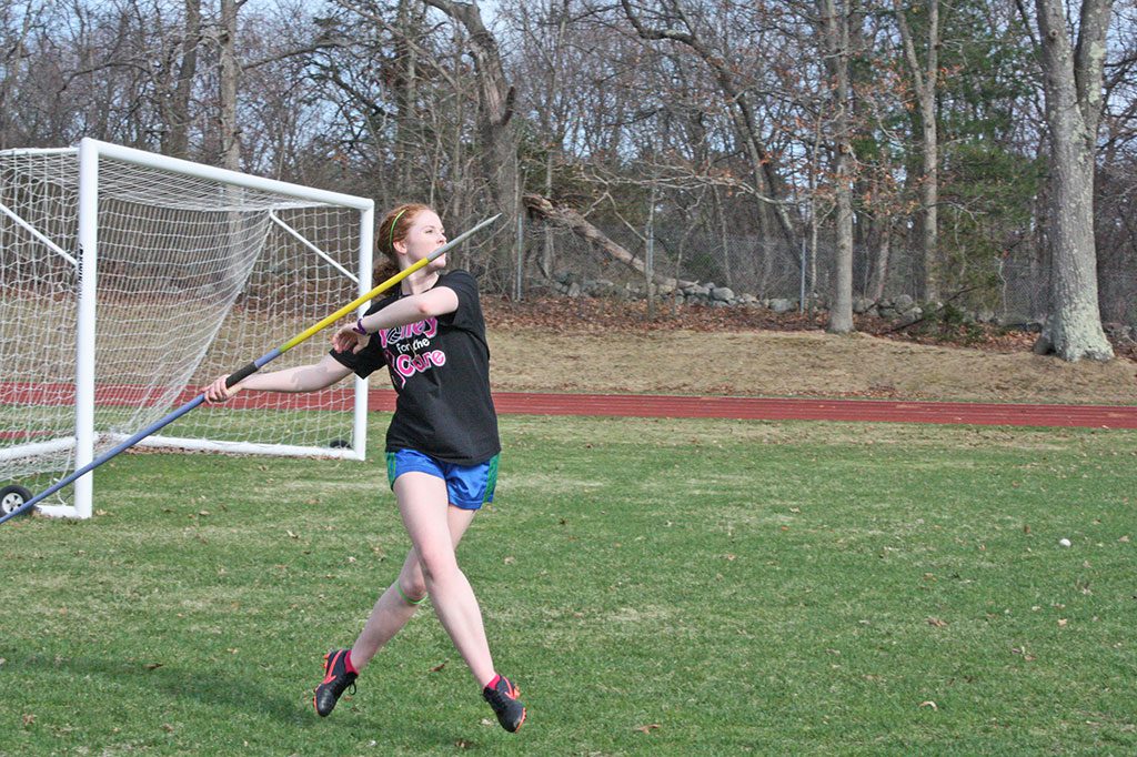 WALKING ON AIR. Marie Norwood performs intricate crossover steps as she prepares to throw the javelin at practice. The junior placed third in the event in the first meet of the season against Newburyport. (Maureen Doherty Photo)
