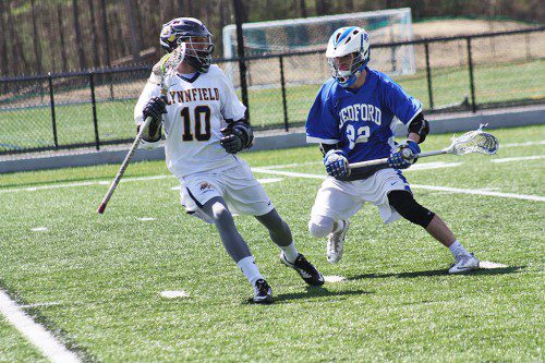 SENIOR CAPTAIN Jonathan Knee (10) scored a goal and had an assist during the Pioneers’ 10-7 loss to Bedford on Friday, April 24 at Pioneer Stadium. (Dan Tomasello Photo)