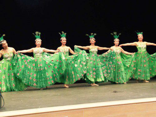 WEARING beautiful green “fan” dresses, the JIA Yun Dance Troupe performed Friday night in the auditorium of the Galvin Middle School for those who attended METCO International Night. (Janine Cook Photo)