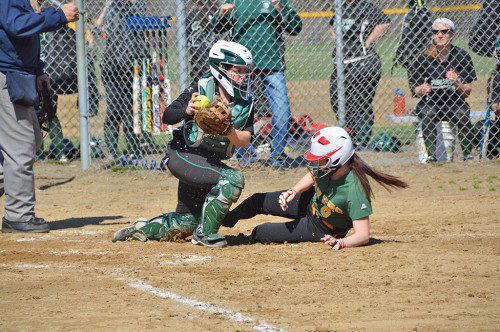 OUT AT THE PLATE. Hornet senior Bryanne Riley is out at the plate on a close play in the second inning of last week's win over Pentucket. (Bob Turosz Photo)