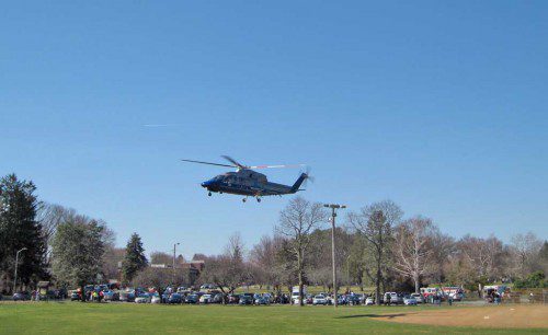 FOLLOWING release from under his silver 2003 Cadillac, an 82-year-old Reading man was med-flighted from Veterans’ Field to a Boston Hospital for treatment of injuries to his legs. (Gail Lowe Photo)