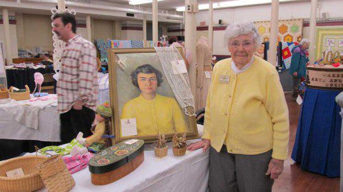 IN 1956, artist Priscilla Evans painted a portrait of Margaret “Peg” Whipling, on display at the Wakfefield Arts and Crafts Society’s annual exhibit and sale, held Saturday at the First Parish Congregational Church. Nearly 60 years later, Peg continues to favor yellow sweaters. (Gail Lowe Photo)