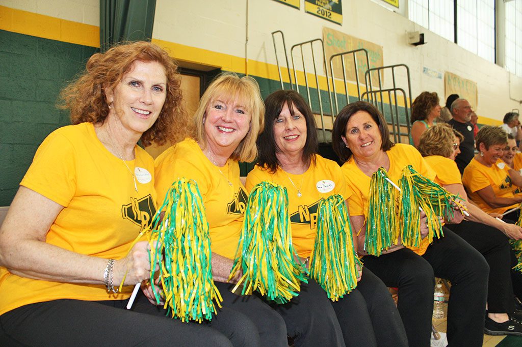 That 70s show THE HORNET basketball cheerleaders from the 1970s showed they still have what it takes to keep the fans engaged at Saturday's Geezer Game to celebrate the retirement of the original NRHS gymnasium. The alumni team included, from left: Paula Quinlan Gifford, '74, Debbie Phillips Nichols, '73, Karen Bakas Walsh, '71, and Kathy Brennan Allison, '72. (Maureen Doherty Photo)