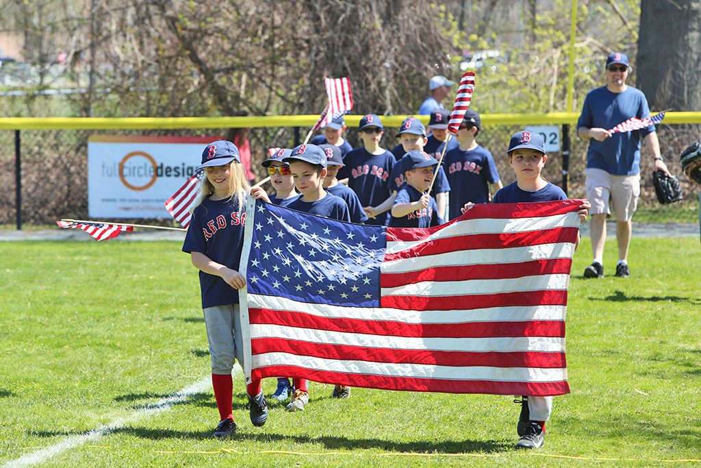 THE RED SOX of the Churchill American Little League proudly walk the field during the annual opening day parade at Lewis-Monk Field. (Donna Larsson Photo)