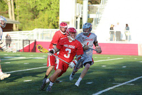 MELROSE OFFENSE did the job on Wednesday, May 20 when the Red Raider lacrosse team upset Watertown (12-3) to earn a spot in playoffs. Pictured in Raider Mike Pedrini. (Donna Larsson photo)