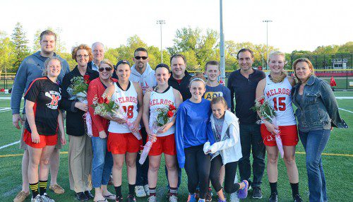 AMONG THOSE who helped the Melrose Lady Raider lacrosse team reach playoffs are their seniors, who were saluted recently at their Senior Night. They include (pictured with their families, from left) captain Anna Steele, Breana Porcello, Kayla Matucci and Brittany Parker. (courtesy photo) 