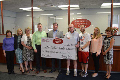 THE Wakefield Co-operative Bank has made a $2,500 donation to the Wakefield Independence Day Parade Committee to help bring back the parade. This is the largest donation to date and will help pay for the two dozen marching bands and drum corps scheduled to march on the Fourth of July. The Wakefield Independence Day Parade Committee is a 501(c)(3) corporation and all donations are tax deductible. Shown, from left: Joyce Grasso, vice president human resources; Elaine Guaetta, assistant vice president main office branch manager; Lois Hayward, vice president retail; Michael Wolnik, president/chief executive officer; Chad Moore, vice president personal banking; Steve Gates, member of the Wakefield Independence Day Committee (WIDC); Patrick Sullivan, chairman WIDC; Jennie Terry, marketing manager and Janet Rivers, lending personal banker.