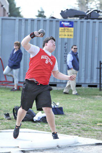 BEN JOLY, a senior, had a throw of 50-2 in the shot put to take first place and lead a Warrior sweep of the event. Joly improved his distance by a little over a foot. (Donna Larsson File Photo)
