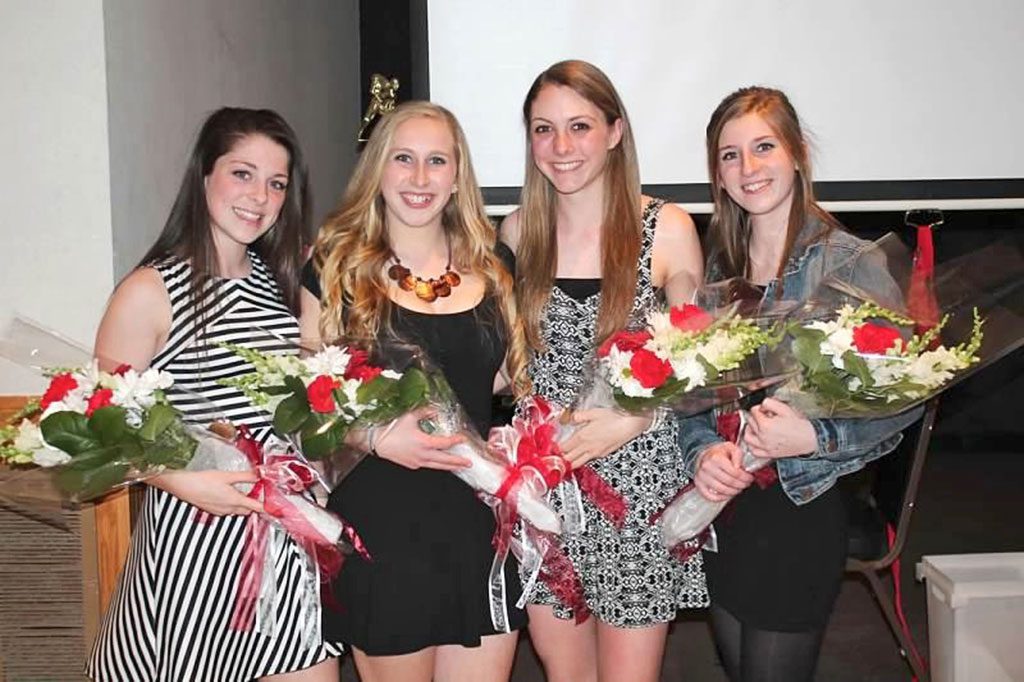 THE NEW captains of the WMHS girls' hockey team were named. From left to right are Meghan Guarino (’14-’15 captain), Meaghan Kerrigan (’15-’16 captain), Julianne Bourque (’15-’16 captain), and Miriam Wood (’14-’15 captain). (Brigid Scanlon Photo)