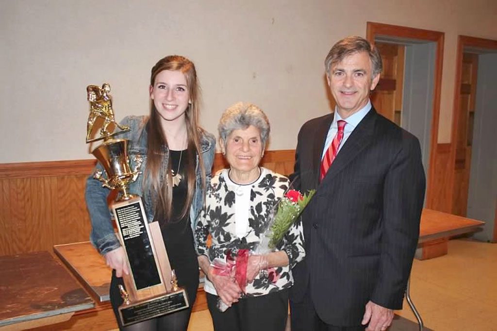 THE Dom Guiffre Memorial Award was presented to Miriam Wood (left) at the recent WMHS girls' hockey banquet. Making the presentation is Delia Guiffre (center). On the right is Head Coach Jack Foley. (Brigid Scanlon Photo)