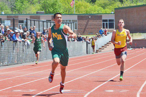 JUNIOR BEN HUI gives the 400 meter everything he's got in the CAL championships. (John Friberg Photo)