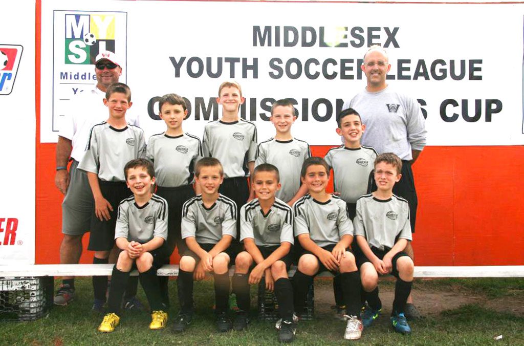 THIS PAST weekend, the boys' U10 Team 5 played in the Middlesex Youth Soccer League Commissioner's Cup in Woburn. They finished first in their division beating Evertt and Burlington but lost an exciting game to Somerville. In the front row (left to right) are Evan Zeltsar, Robert Brown, Bryce Olsen, Tyler Roycroft and Adam Lambiaso. In the second row (left to right) are Jackson McDermott, Oisin Cullen, Will Riley, Adam Skobe and Evan Bernardo. In the back row are Coach Al Roycroft (left) and Coach Randy Brown.