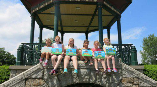 JUNIOR GIRL SCOUTS spent a recent afternoon painting images of the Bandstand on the Lower Common. The girls learned about blending primary colors and layering their painting to produce their masterpieces. Seated from the left are J. Zajac, S. Pudvah, M. Story, M. McConnell, L. Duval and E. Callahan.