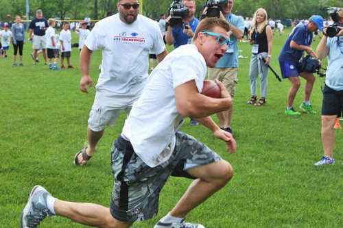 ROB GRONKOWSKI of the New England Patriots put on a show during the sold out Citi Rob Gronkowski Football Clinic held at Melrose High last weekend. (Donna Larsson photo) 