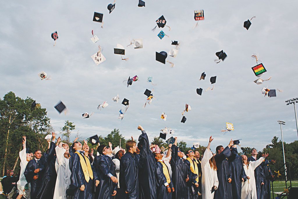IT'S A WRAP for the Lynnfield High School Class of 2015 as they toss their caps into the air to celebrate their graduation Friday night. (Maureen Doherty Photo)