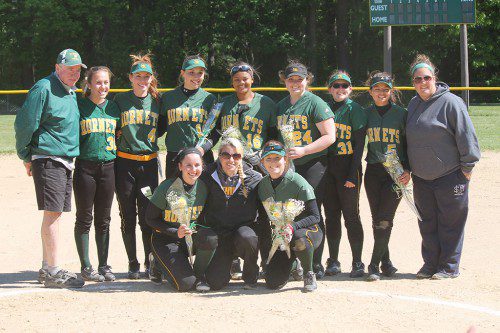 THE NRHS VARSITY SOFTBALL TEAM honored their senior members before the 5–3 victory over the Medford Mustangs. Front row, (left to right): Captain Sophie Warren, Head Coach Michelle Morales, Captain Bryanne Riley. Standing: Assistant Coach Paul Greene, Kelsey DeMild, Kellie Sovak, Jillian Trischitta, Kendra Butner, Erin Kodis, Amanda Catania, Monica Ferrazzani, and Assistant Coach Katie Davis. (Photo by Kevin Riley)