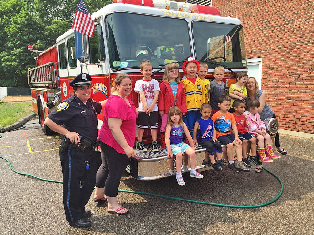 JENNIFER ARONSON’S morning pre-school class at the Doyle Early Education Center recently participated in an Emergency Vehicle Washing Day. (Jenn MacRobbie Photo)