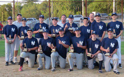 THE YANKEES repeated as Town Series champs in Senior Little League Baseball. In the front row (L-R) are Brett Maloney, John Stanfield, Bobby Pearl, Brendan Coughlin, Ryan Smith and Max Marchino. In the second row (L-R) are Cameron Coleman, Sean Joudrie, Anthony DeVito, Timmy Coggswell, Mike Lucey, Justin Harding, Carmen Sorrentino and Shawn Carlson. In the back row (L-R) are coaches Michael Maloney, Rick Norton and Paul Pearl.