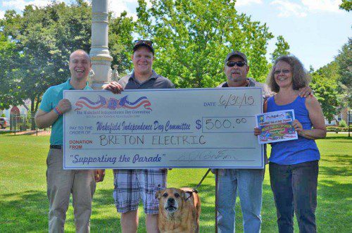 BRETON ELECTRIC was a sponsor of the resurgent Wakefield Independence Day Parade held to wide acclaim last Saturday. From the left are Pat Sullivan, Paul Watts, Buster, Steve Breton and Wendy Dennis.