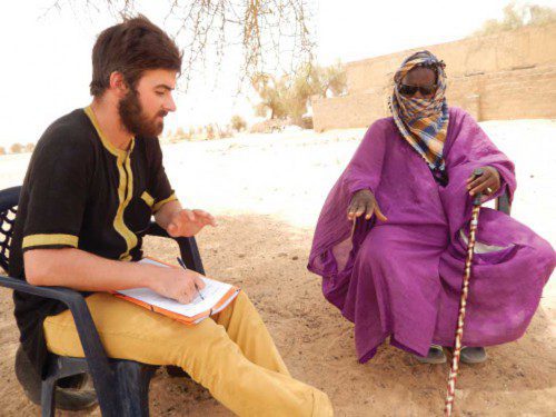 PEACE CORPS volunteer Corey Dolbeare interviews a village chief in Senegal about a farming method he'd like to teach to farmers. He soon learns that communicating his ideas in the native Pulaar language is the first obstacle to be overcome.