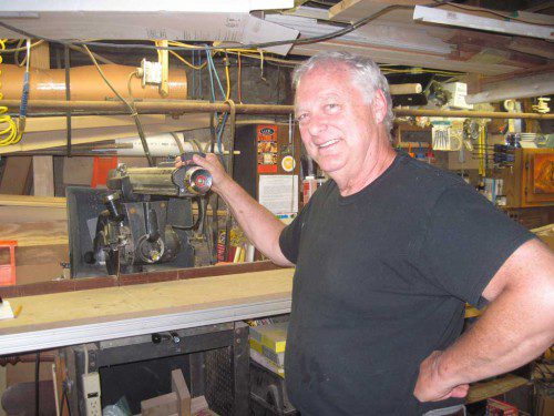 DAN NOREN is shown in his woodworking shop in the basement of his West Side home. (Gail Lowe Photo)